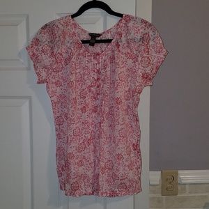Sheer red floral shirt.